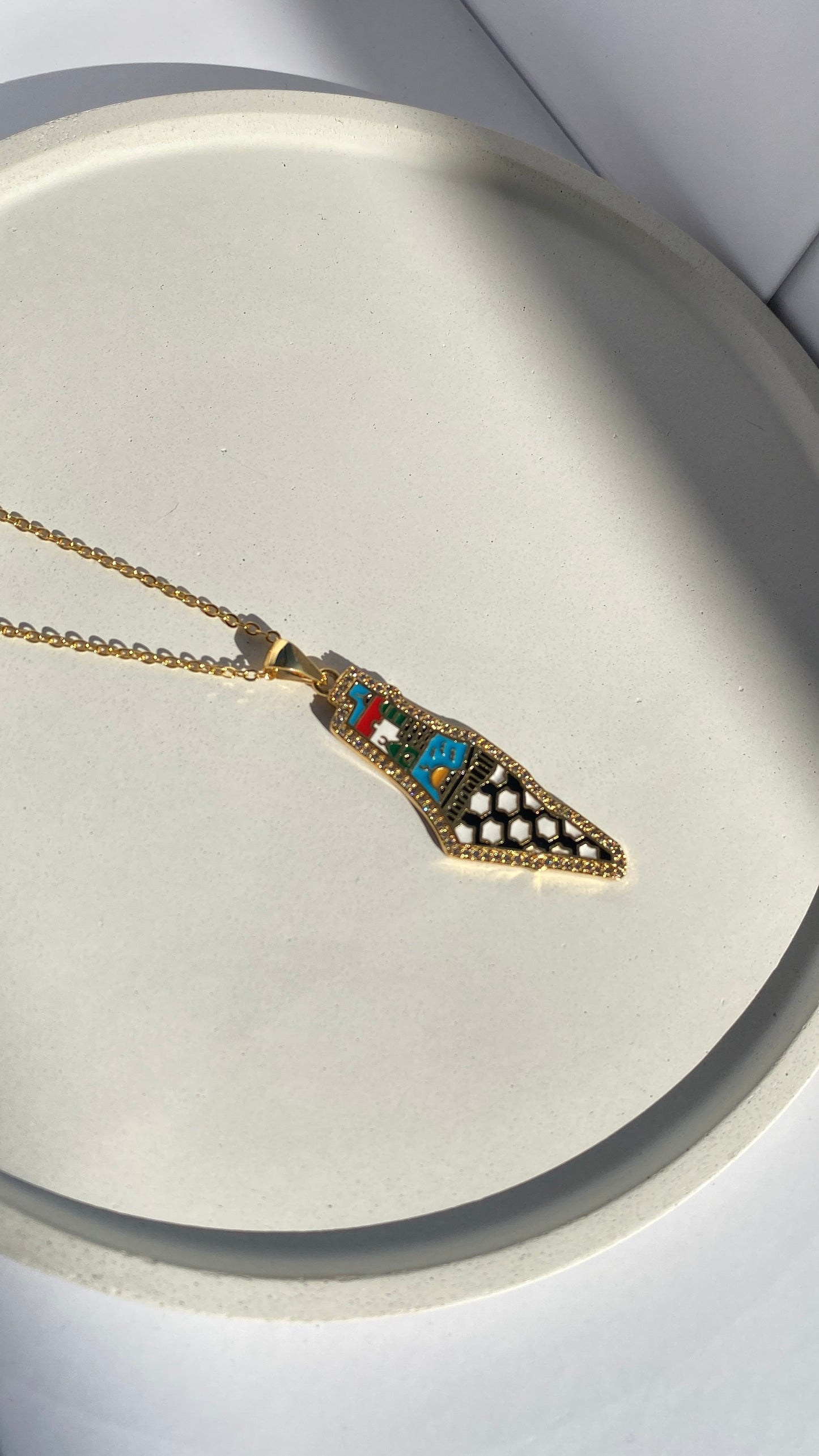 Palestine shimmer map necklace with abstract colors in gold