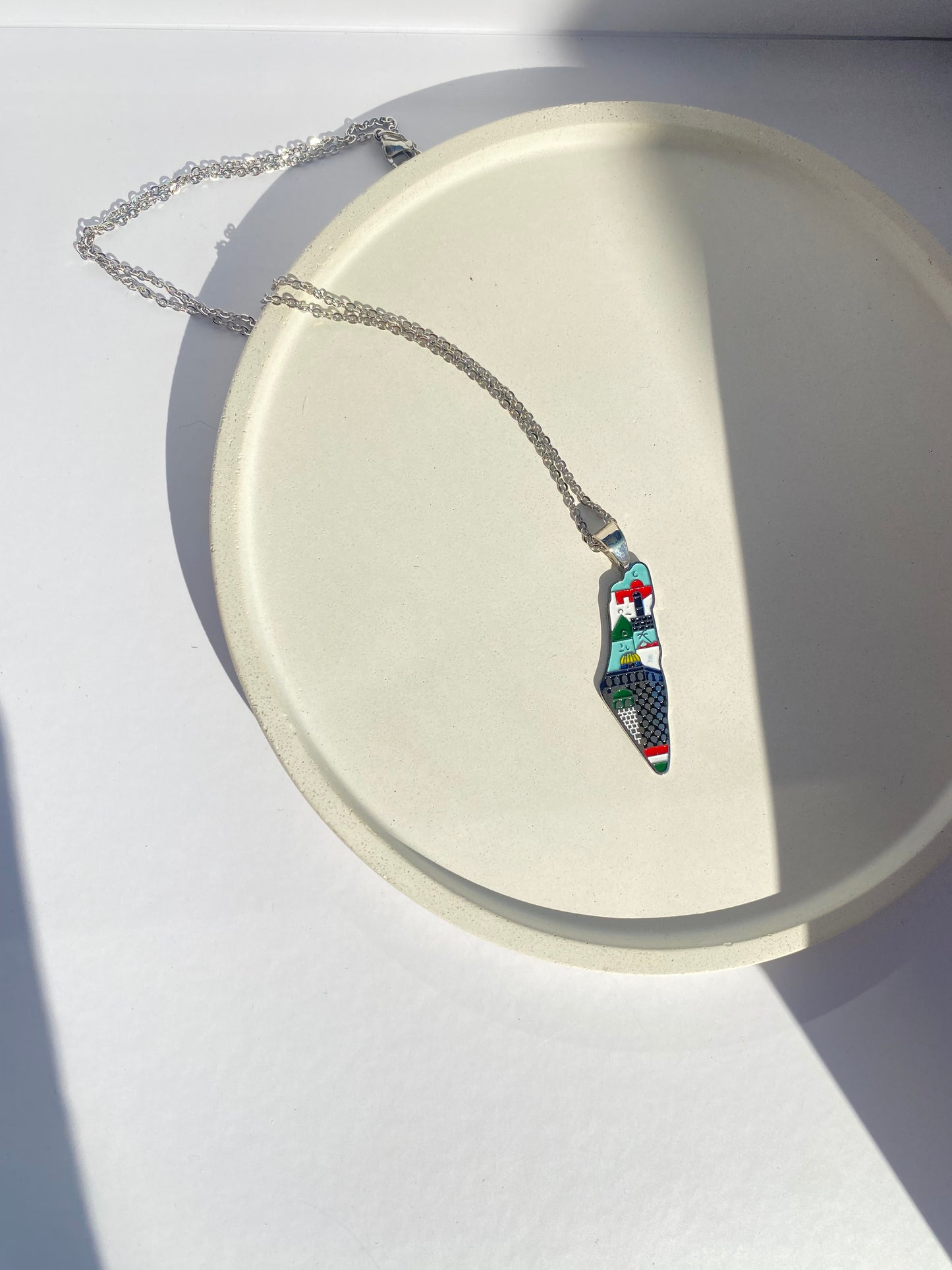 Palestine map necklace with abstract colors in silver