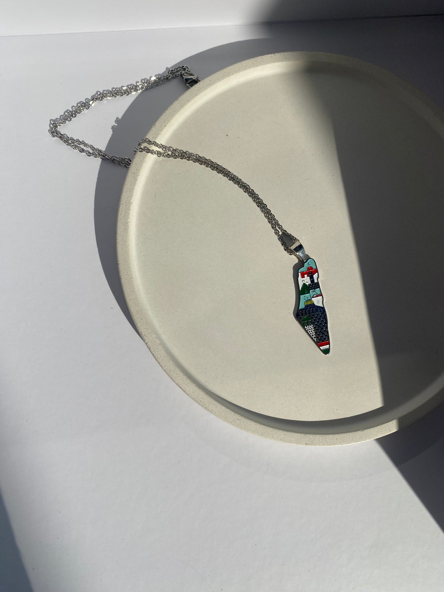 Palestine map necklace with abstract colors in silver